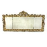 Mid 19th century giltwood wall mirror, with carved and pierced foliate enclosing three bevelled plat