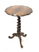 Victorian rosewood pedestal occasional table with lobed circular top. Raised on spiral turned column