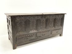 Large 18th century oak mule chest, with hinged lid over four panelled front carved with floral decor