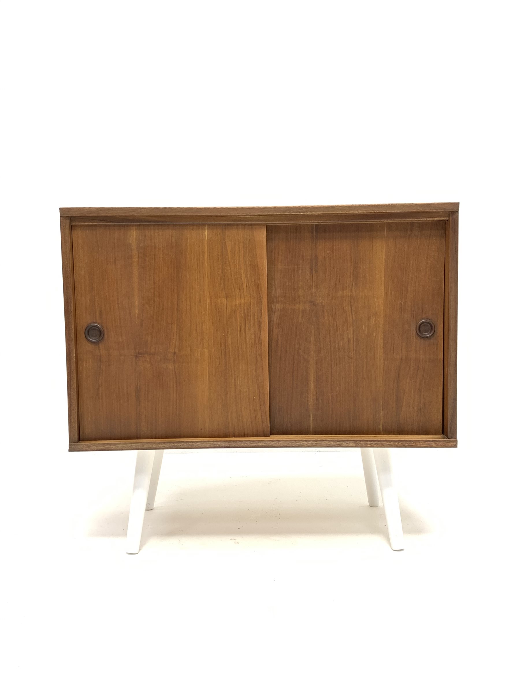 Mid century Danish teak PS systems cabinet, with two sliding doors, raised on tapered white supports
