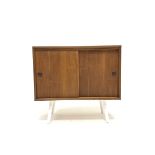 Mid century Danish teak PS systems cabinet, with two sliding doors, raised on tapered white supports