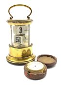 Early 20th century brass and glass ticket or Plato clock, together with a pocket barometer in small