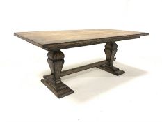 Rustic oak rectangular twin pedestal dining table, each pedestal raised on stepped rectangular base,