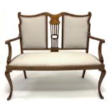 Edwardian mahogany two seat salon settee, the shaped cresting rail over central foliate scroll inlai