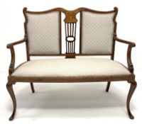 Edwardian mahogany two seat salon settee, the shaped cresting rail over central foliate scroll inlai