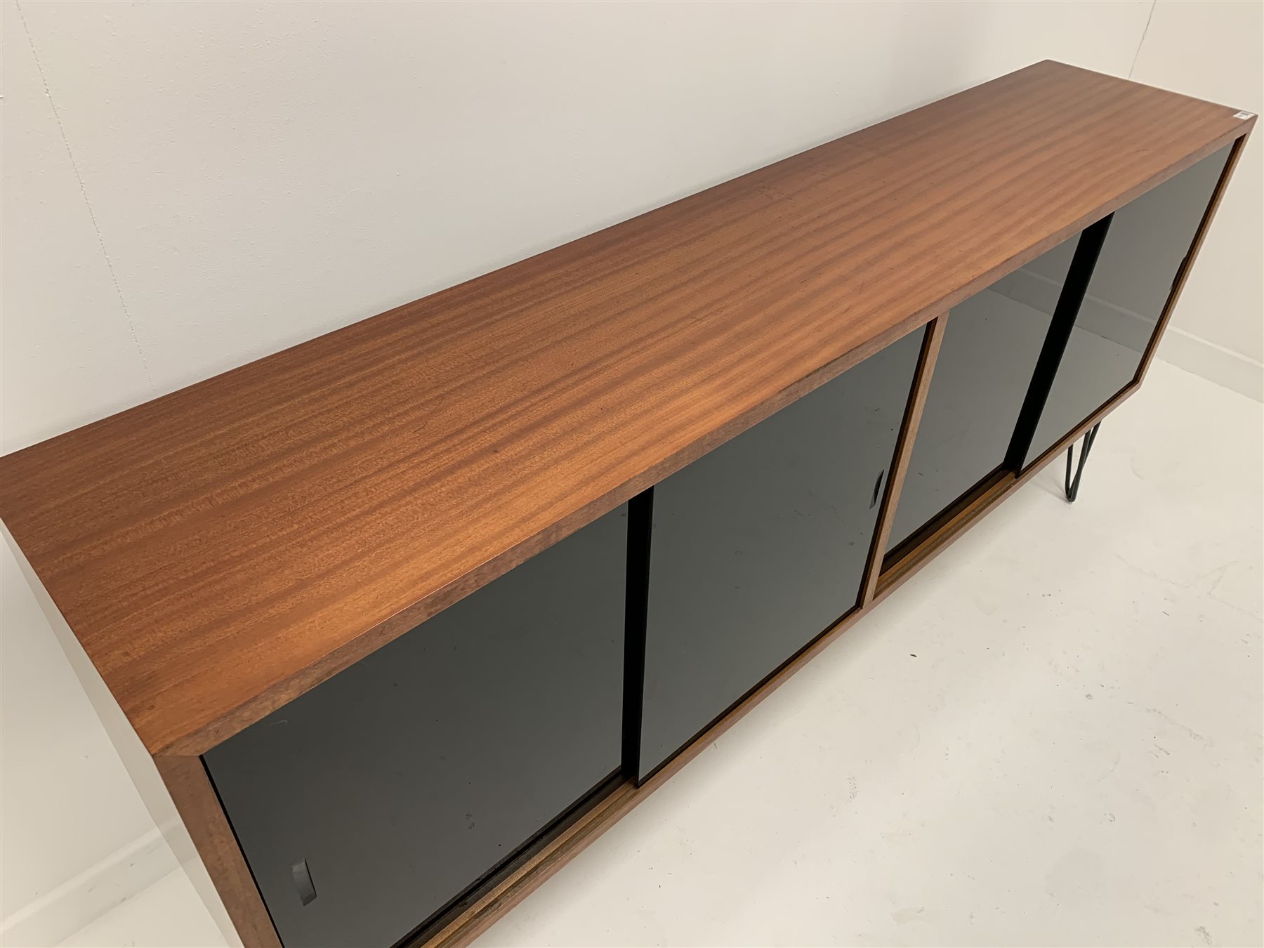 Mid century teak sideboard, fitted with four black lacquered glazed sliding doors enclosing adjustab - Image 4 of 5