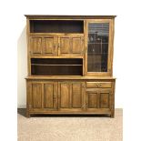 20th century oak dresser, top section fitted with cupboards and open shelves, three panelled cupboar