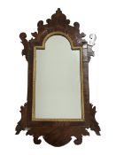 20th century Georgian style mahogany mirror, shaped fret work frame, stepped arched aperture with mo