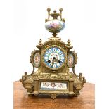 19th century French brass mantel clock with Sevres porcelain panels, surmounted by urn finial, eight