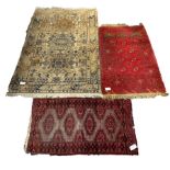 Afghan red prayer rug, with with central mihrab panel and gul motif, (77cm x 130cm) together with an