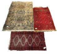 Afghan red prayer rug, with with central mihrab panel and gul motif, (77cm x 130cm) together with an