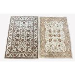 Chinese machined wool cream ground rug, decorated with interlaced foliate, (240cm x 165cm) and anoth