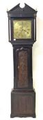 Late 18th/Early 19th century carved oak longcase clock, the brass dial with gilt metal spandrels, in