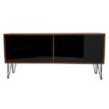 Mid century teak sideboard, fitted with four black lacquered glazed sliding doors enclosing adjustab