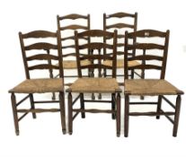 Set of five (2+3) oak ladderback dining chairs, with rush seats, raised on turned supports and stret