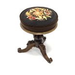 Early Victorian rosewood revolving adjustable piano stool, cushioned seat upholstered in floral need