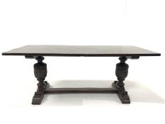 Early 20th century dark oak refectory style dining table, plank top raised on baluster turned leaf c