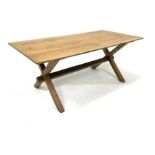 Early 20th century oak refectory style dining table, with rectangular top raised on 'X' supports uni