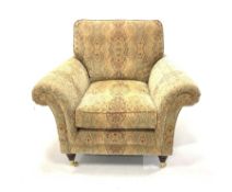 Parker Knoll Burghley armchair upholstered in Baslow Medalli Gold fabric, raised on turned front sup