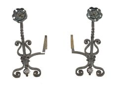 Pair of Blacksmith made wrought iron andirons, with hammered copper Yorkshire rose finials and scrol