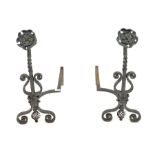 Pair of Blacksmith made wrought iron andirons, with hammered copper Yorkshire rose finials and scrol