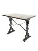 Victorian design cast iron pub table, with stained pine top and supports decorated with scrolled fol