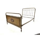 Early 20th century scumbled cast iron 4ft6" bed frame with cross banded walnut banner with inlay rai