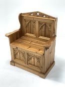 Stripped pine single seat box pew of gothic design, two panelled back and base, seat hinged to revea