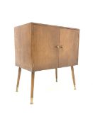 1950s walnut veneered LP cabinet with brass handles and angular legs, W61cm