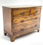 George III mahogany bow front chest, two short and two long drawers, canted upright corners, on brac