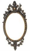 Late 19th century giltwood and gesso oval wall mirror, with bevelled plate enclosed by floral moulde