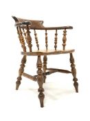 19th century yew and elm smokers bow armchair, with spindle back, saddle seat, raised on ring turned