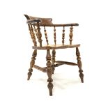 19th century yew and elm smokers bow armchair, with spindle back, saddle seat, raised on ring turned