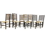 Harlequin set of eight 19th century oak ladder back chairs, with rush seats and turned supports, W49