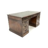 Georgian design mahogany pedestal desk with tooled leather writing surface, fitted with nine drawers