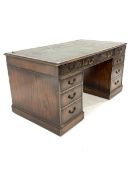 Georgian design mahogany pedestal desk with tooled leather writing surface, fitted with nine drawers