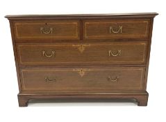 Early 20th century mahogany chest fitted with two short and two long drawers, with satinwood banding