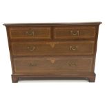 Early 20th century mahogany chest fitted with two short and two long drawers, with satinwood banding