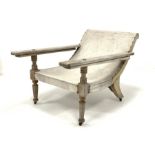 Early 20th century teak plantation chair, with turned front supports, W80cm