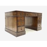 Edwardian mahogany pedestal partners desk with inset writing surface, fitted with nine drawers on a