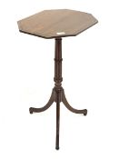 Regency mahogany tripod table, octagonal top with chequered inlayed band, over reeded and ring turne