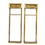 Pair Regency gilt wood and gesso pier glass mirrors, the globular frieze decorated with central flow