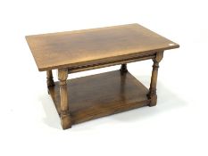 Titchmarsh and Goodwin style honey oak coffee table, raised on turned and block supports united by u