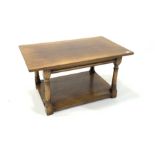 Titchmarsh and Goodwin style honey oak coffee table, raised on turned and block supports united by u