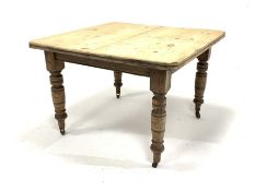 Victorian pine dining table, the top with canted corners raised on turned supports and castors, 106c