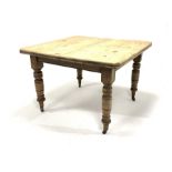 Victorian pine dining table, the top with canted corners raised on turned supports and castors, 106c