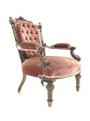 Victorian mahogany open armchair, floral carved cresting rail over deep buttoned upholstered back, p