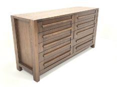 Contemporary walnut sideboard, fitted with two banks of five drawers, raised on block supports, W170
