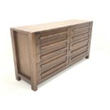 Contemporary walnut sideboard, fitted with two banks of five drawers, raised on block supports, W170