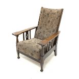 Early 20th century Arts and Crafts oak reclining armchair, with upholstered seat and back, raised on